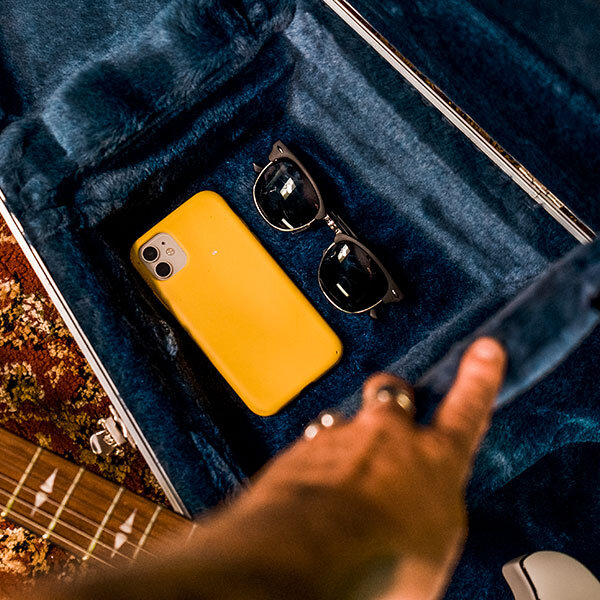 sunglasses and iPhone inside hardshell case with blue interior